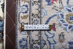 Surface texture of 2000s Kashan rug with natural Wool and intricate pattern