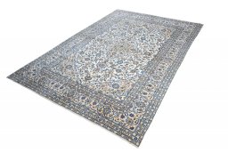 Corner detail of 2000s Kashan rug showing border pattern and Wool pile