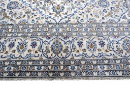 Close-up detail of 2000s Kashan rug from Iran / Persia showing Wool weave