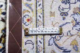 Surface texture of 2000s Kashan rug with natural Wool and intricate pattern