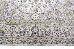 Close-up detail of 2000s Kashan rug from Iran / Persia showing Wool weave