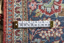 Backside of handmade 1930s Kashan rug showing knot structure and weave density