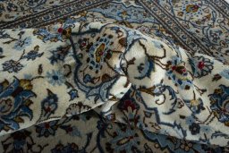 Close-up detail of 2000s Kashan rug from Iran / Persia showing Wool weave