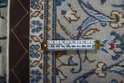 Surface texture of 2000s Kashan rug with natural Wool and intricate pattern