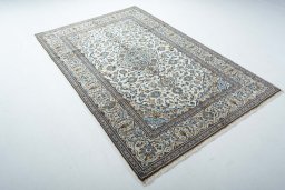 Close-up detail of 2000s Kashan rug from Iran / Persia showing Wool weave