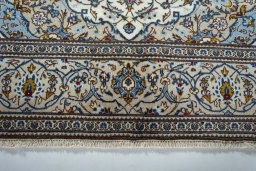Close-up detail of 2000s Kashan rug from Iran / Persia showing Wool weave
