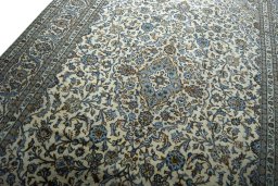 Backside of handmade 2000s Kashan rug showing knot structure and weave density