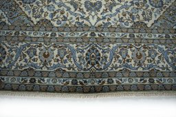 Close-up detail of 2000s Kashan rug from Iran / Persia showing Wool weave
