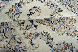 Corner detail of New Kashan rug showing border pattern and Wool pile
