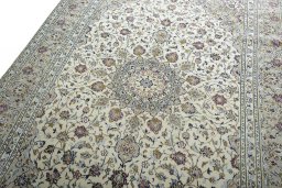 Backside of handmade 2000s Kashan rug showing knot structure and weave density