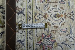 Close-up detail of 2000s Kashan rug from Iran / Persia showing Wool weave