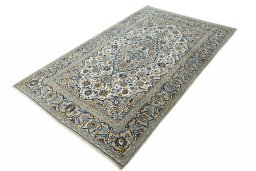 Corner detail of 2000s Kashan rug showing border pattern and Wool pile