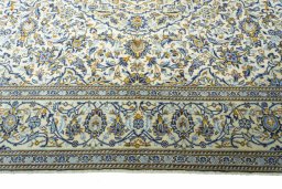 Corner detail of New Kashan rug showing border pattern and Wool pile
