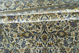 Close-up detail of New Kashan rug from Iran / Persia showing Wool weave