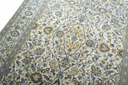 Backside of handmade New Kashan rug showing knot structure and weave density