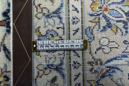 Backside of handmade 2000s Kashan rug showing knot structure and weave density