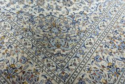 Close-up detail of 2000s Kashan rug from Iran / Persia showing Wool weave