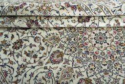 Close-up detail of 2000s Kashan rug from Iran / Persia showing Wool weave