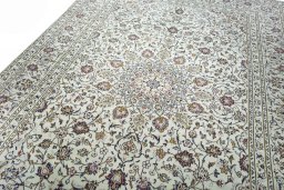 Backside of handmade 2000s Kashan rug showing knot structure and weave density