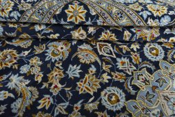 Close-up detail of 2000s Kashan rug from Iran / Persia showing Wool weave