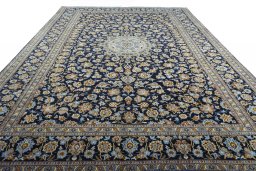 Surface texture of 2000s Kashan rug with natural Wool and intricate pattern