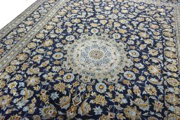Backside of handmade 2000s Kashan rug showing knot structure and weave density