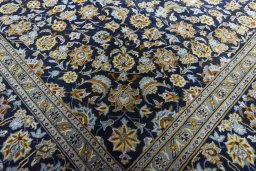 Close-up detail of 2000s Kashan rug from Iran / Persia showing Wool weave