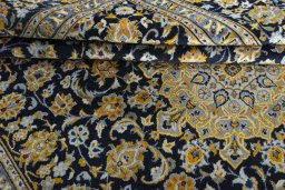 Close-up detail of 2000s Kashan rug from Iran / Persia showing Wool weave