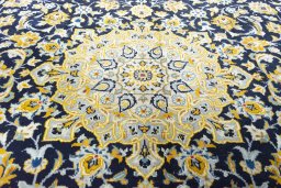 Central medallion detail of 2000s Kashan rug from Iran / Persia