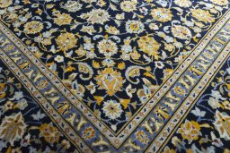 Close-up detail of 2000s Kashan rug from Iran / Persia showing Wool weave