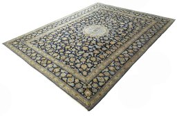 Corner detail of 2000s Kashan rug showing border pattern and Wool pile