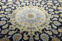 Central medallion detail of 2000s Kashan rug from Iran / Persia