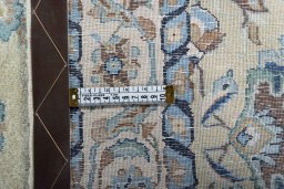 Backside of handmade 1950s Kashan rug showing knot structure and weave density