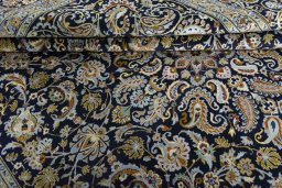 Close-up detail of 2000s Kashan rug from Iran / Persia showing Wool weave