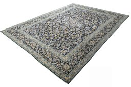 Corner detail of 2000s Kashan rug showing border pattern and Wool pile
