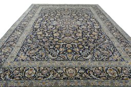 Surface texture of 2000s Kashan rug with natural Wool and intricate pattern