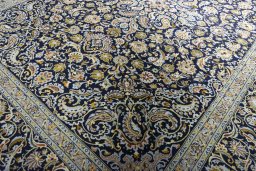 Close-up detail of 2000s Kashan rug from Iran / Persia showing Wool weave