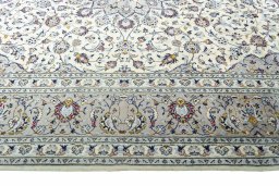 Corner detail of New Kashan rug showing border pattern and Wool pile