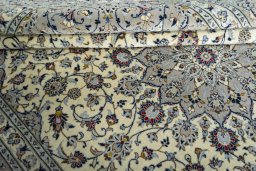 Close-up detail of New Kashan rug from Iran / Persia showing Wool weave