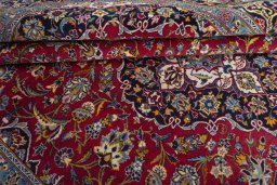 Close-up detail of 2000s Kashan rug from Iran / Persia showing Wool weave