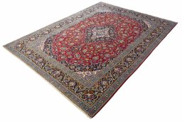 Corner detail of 2000s Kashan rug showing border pattern and Wool pile