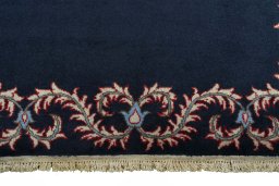 Backside of handmade 2000s Kashan rug showing knot structure and weave density