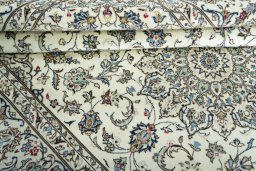Close-up detail of 2000s Kashan rug from Iran / Persia showing Wool weave