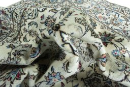 Surface texture of 2000s Kashan rug with natural Wool and intricate pattern