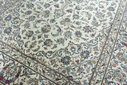 Close-up detail of 2000s Kashan rug from Iran / Persia showing Wool weave