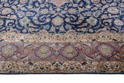 Backside of handmade 1930s Kashan rug showing knot structure and weave density