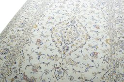 Backside of handmade 2000s Kashan rug showing knot structure and weave density