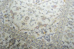 Close-up detail of 2000s Kashan rug from Iran / Persia showing Wool weave