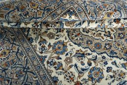 Close-up detail of 2000s Kashan rug from Iran / Persia showing Wool weave