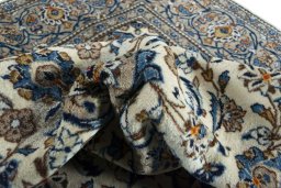 Surface texture of 2000s Kashan rug with natural Wool and intricate pattern